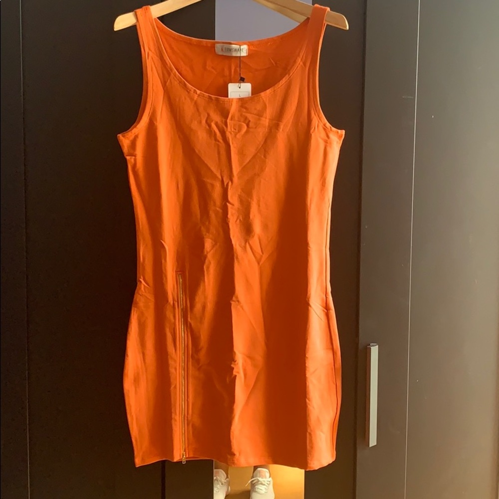 Orange dress with gold zipper on the side